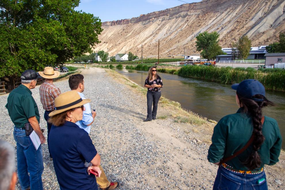 CDA staff listen to Tina Bergozini, general manager of the Grand Valley Water Users Association.