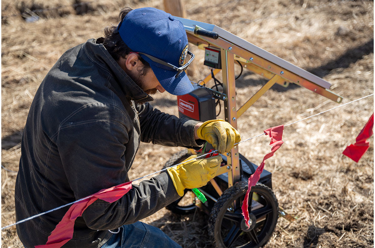 CPW Wolf Conflict Coordinator installs fladry in April 2024