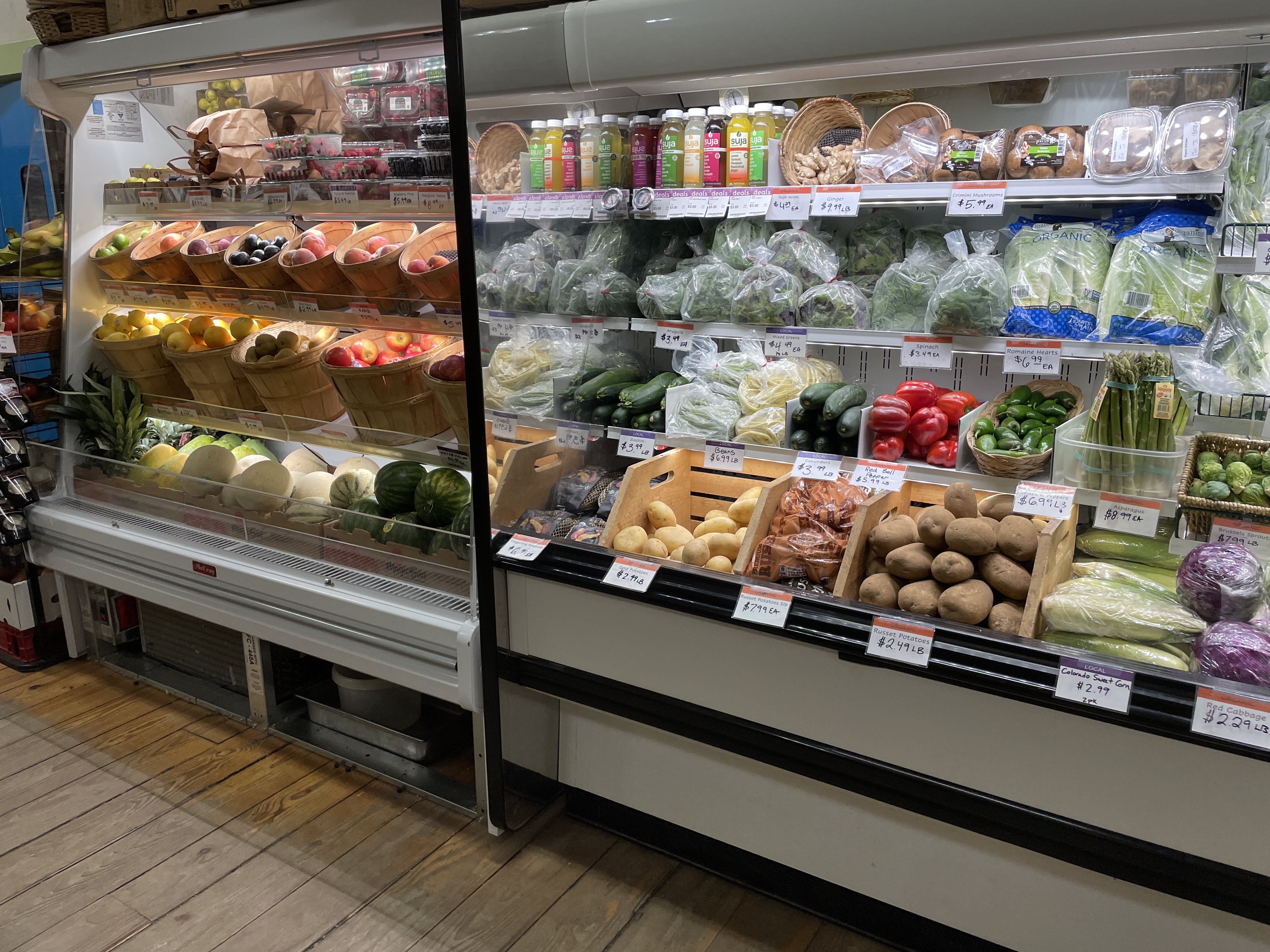 produce display cases in a small grocery store