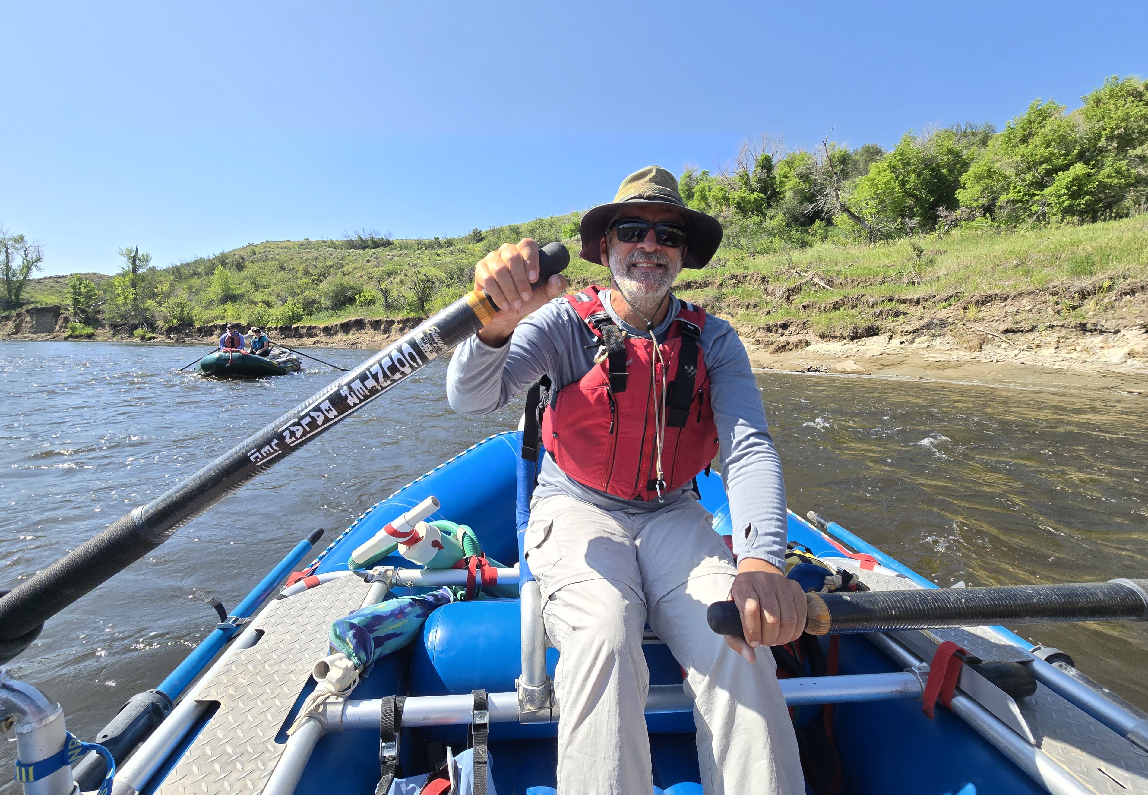 A raft guide steers the vessel on the Yampa river