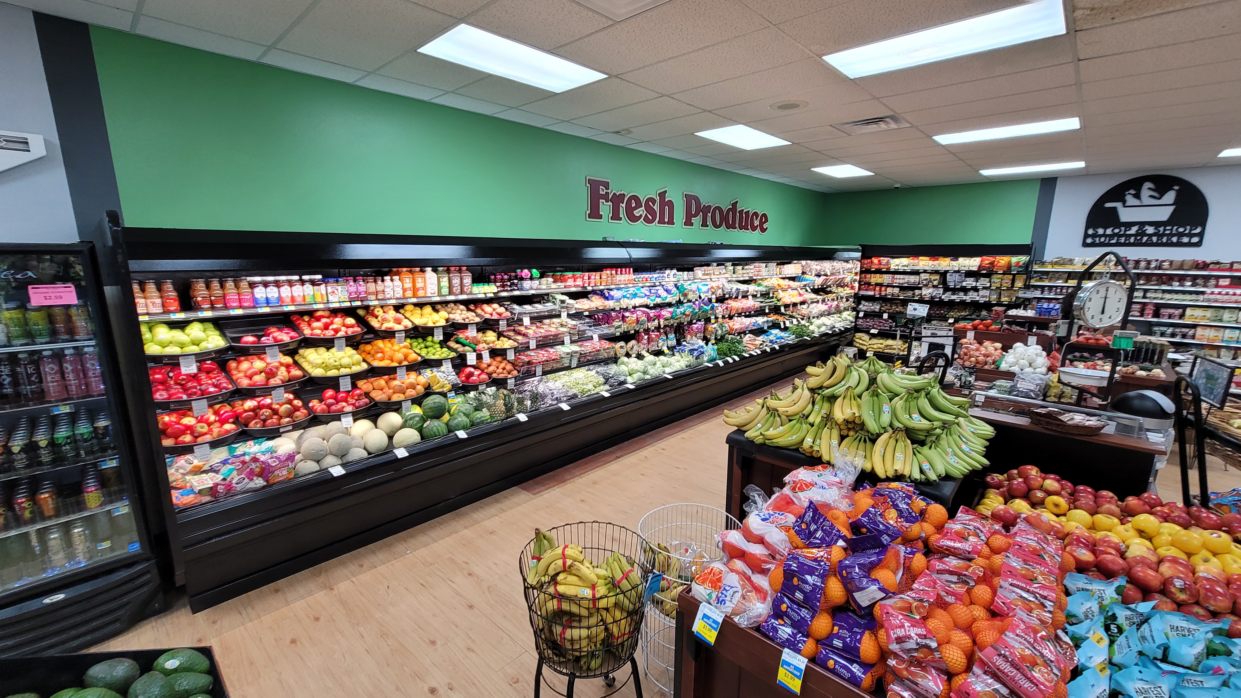 A refrigerated fresh produce section of a grocery store