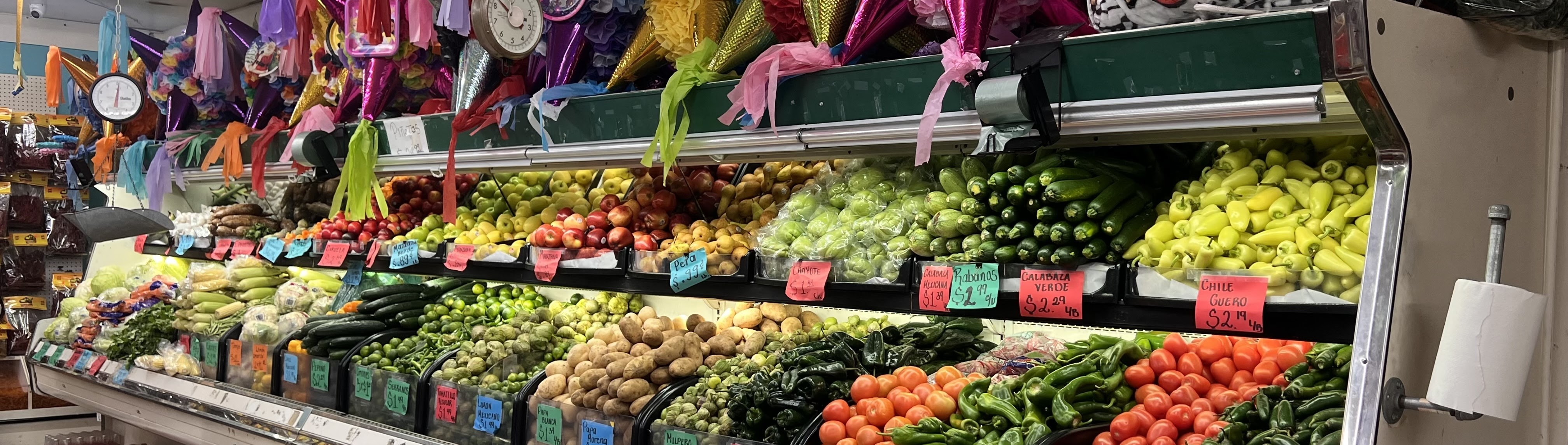 Colorful produce section inside a Carniceria