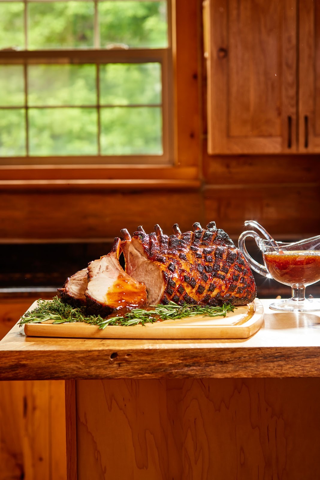 A roasted rack of pork ribs on a cutting board