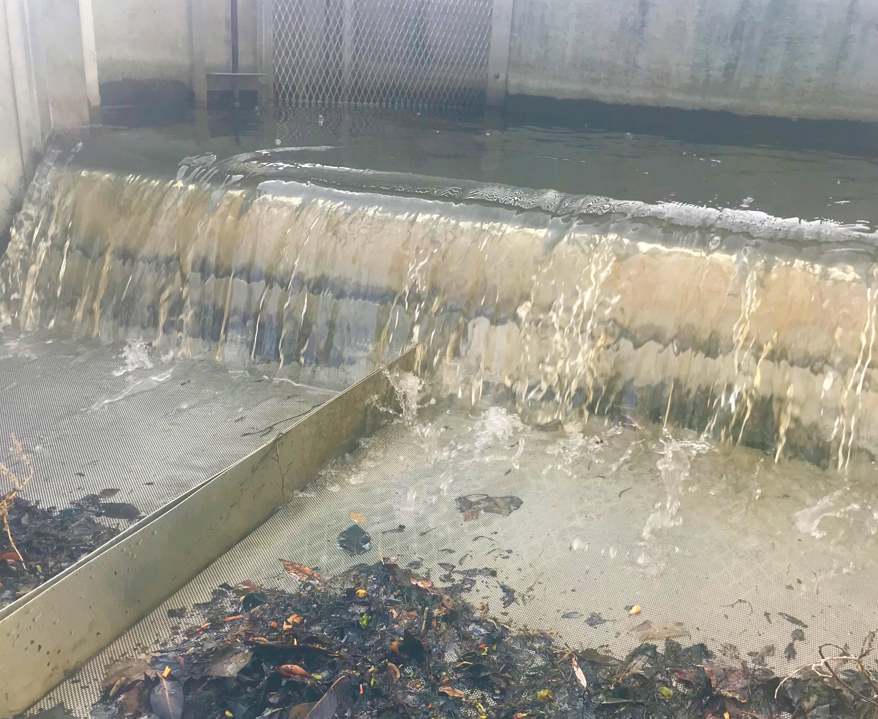 Water pours through metal installations