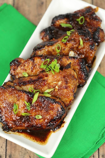 Korean style pork chops with green onion garnish