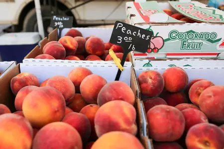 Colorado Peaches at a farmers market stand in Grand Junction, Colorado