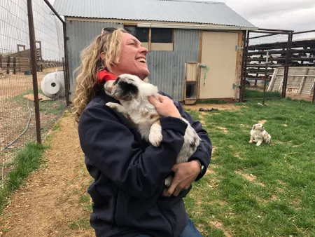 Commissioner Kate Greenberg with Aussie puppies