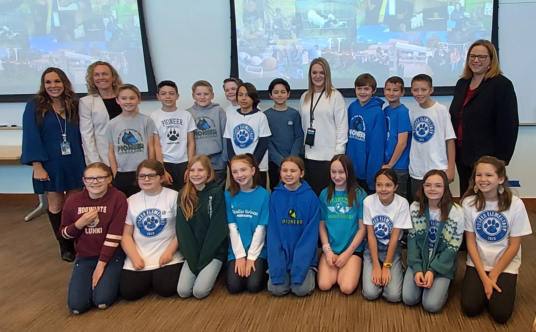 Fifth grade students from Pioneer Elementary School in Douglas County pose with Pioneer principal Gina Landis, Commissioner Kate Greenberg, teacher Susan Irwin, and USDA Under Secretary Jenny Lester Moffitt